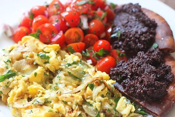 Scrambled Eggs with Gruyère, Fried Pita with Olive Tapenade & Tomato Salad
