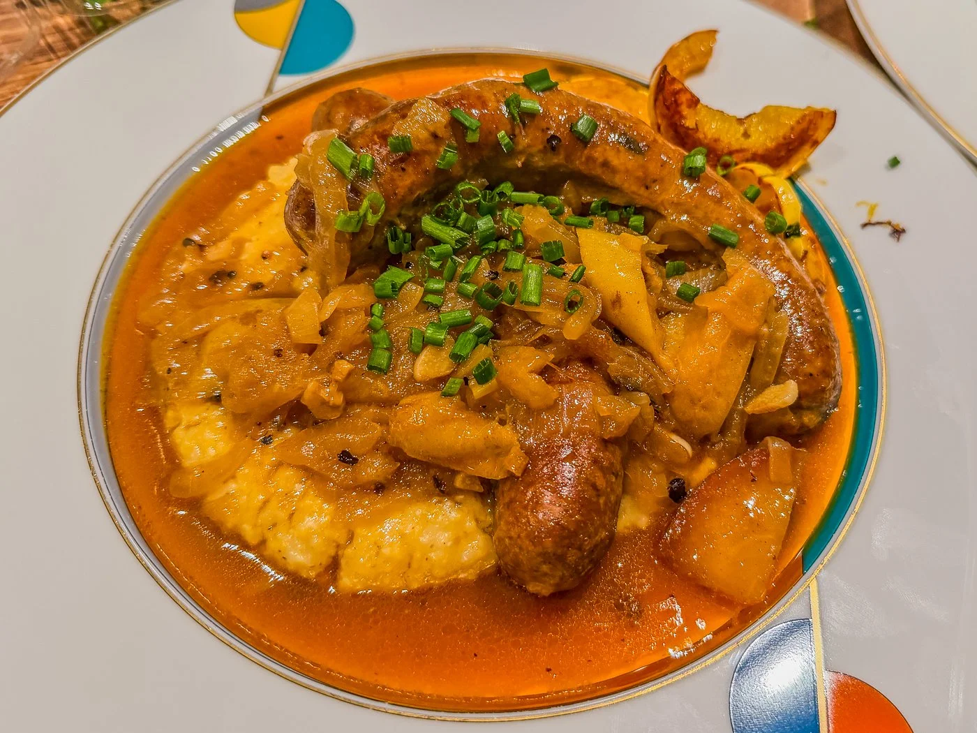 Sausages Braised in Cider with Apples and Onions